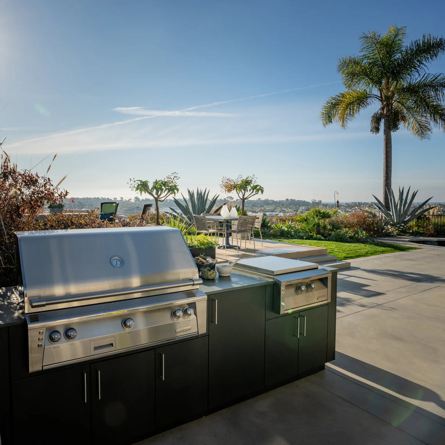 urban bonfire outdoor kitchen with alfresco grill and side burner with beautiful blue sky in the background