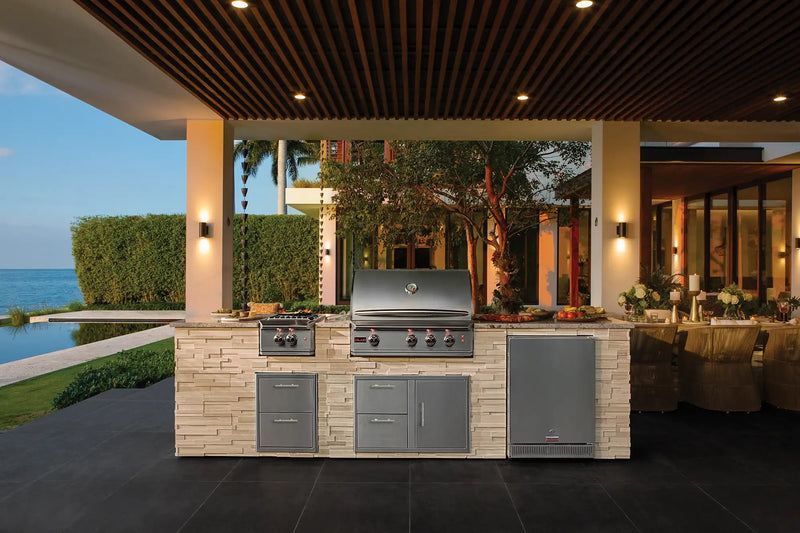 blaze outdoor kitchen with grill, access doors & drawers, and a side burner by the ocean