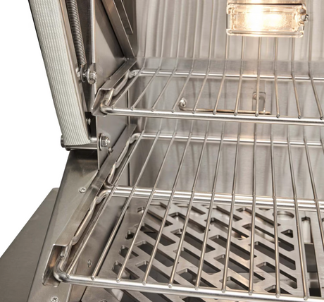Dual rack system and heavy-duty stainless grates inside Coyote pellet grill