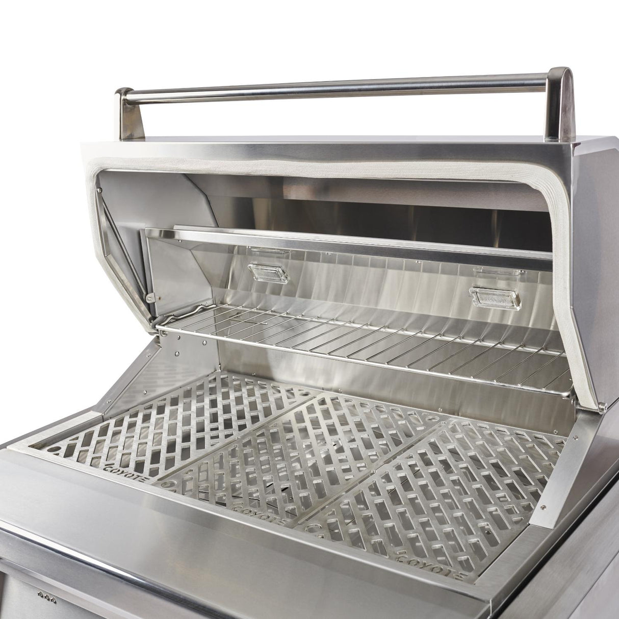 Angled view of the Coyote 36-Inch Pellet Grill showing stainless interior and Versa-Rack