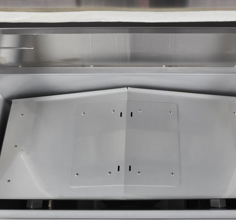 Interior heat deflector shield of the Coyote pellet grill.