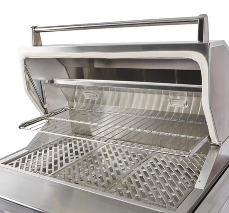 Right side view of the Coyote pellet grill hood open with sear and smoke grates