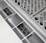 Smart Drop pellet feed system with dual augers inside Coyote pellet grill.