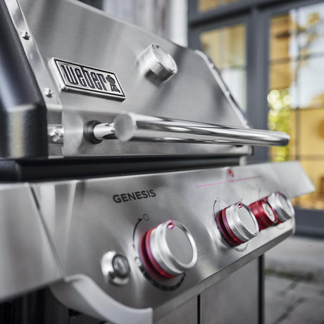 Close-up of the Weber Genesis SP-S-325 stainless steel control panel with red sear zone knob