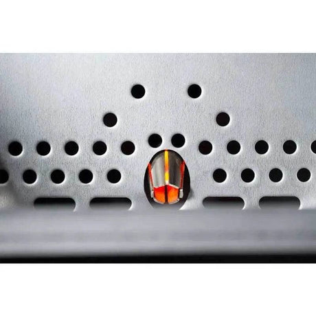 Ceramic igniter inside the burn pot of Yoder Smokers YS640s built-in pellet grill